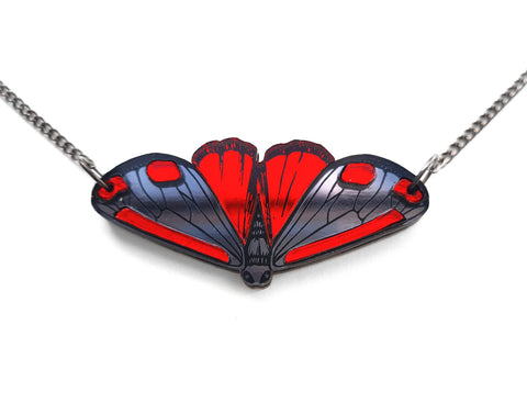 cinnabar moth necklace close up.