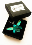 teal glitterbug pendant in box