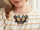 blue tit necklace on model