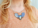 bat necklace on model