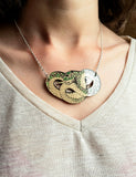 Adder necklace being worn