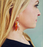 goldfish earring being worn by a blonde woman