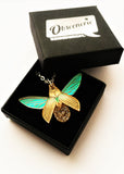 gold glitterbug pendant in box