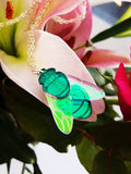 Blowfly pendant on flowers