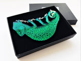 Green chameleon necklace in box