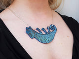 blue chameleon necklace being worn