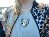 raccoon necklace being worn by a person