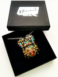 jumping spider necklace in its Obscenerie gift box