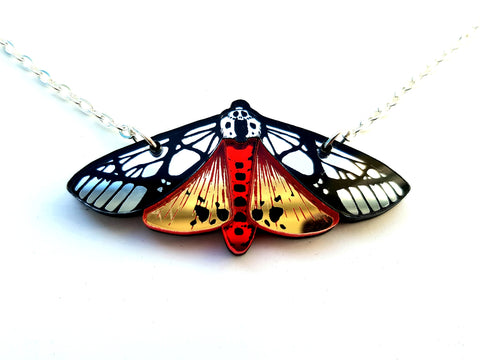 Close up view of the tiger moth necklace