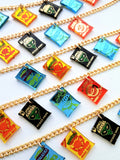 Several snack charm necklaces showing all the crisp necklaces