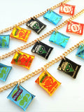 Several snack charm necklaces showing all the crisp necklaces
