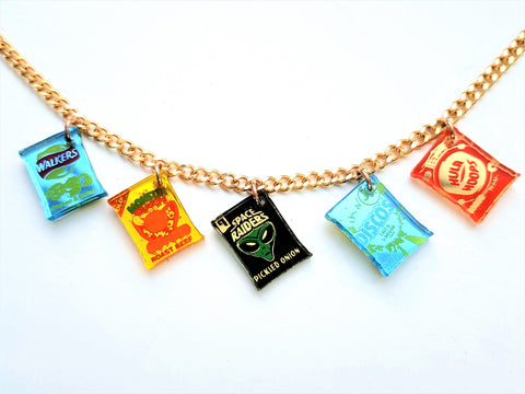Snack charm necklace on gold cuban chain showing Walkers cheese and onion, Monster Munch roast beef, Space Raiders pickled onion, salt and vinegar Discos and ready salted Hula Hoops charms